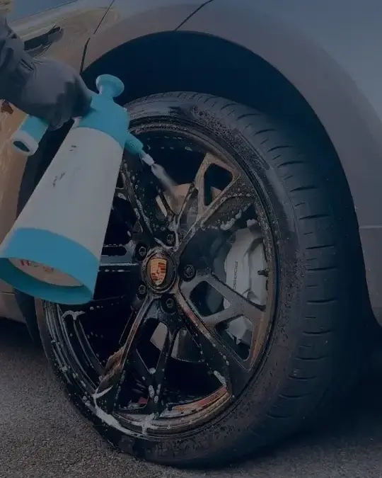 Cleaner being applied to a Porsche alloy wheel
