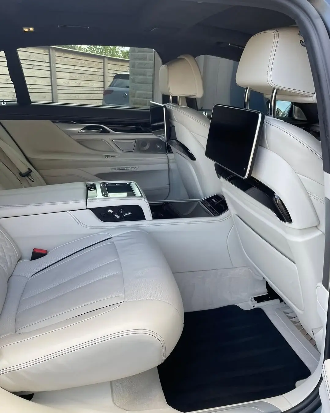 Clean cream leather seats, floor mats and rear cabin